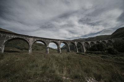 Arch bridge against sky