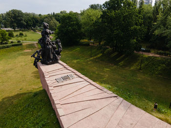 Statue on footpath in park