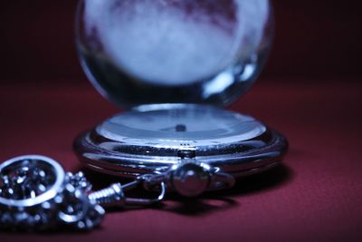 Close-up of clock on table