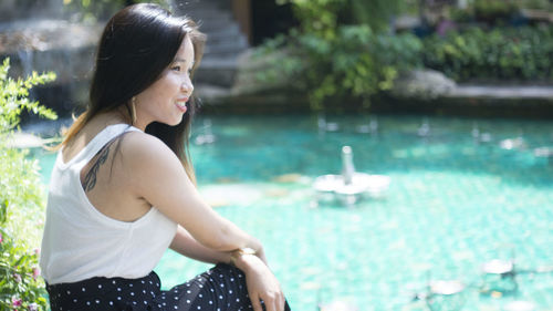 Woman looking at swimming pool