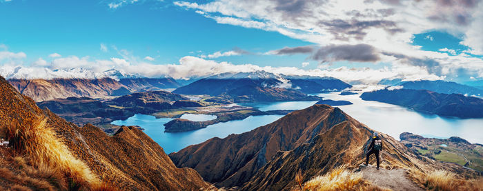 Panoramic view of snowcapped mountains against cloudy sky