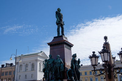 Low angle view of statue against sky