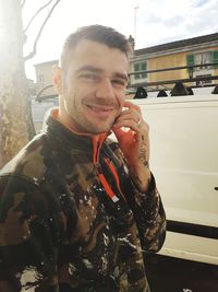 Portrait of young man standing outdoors