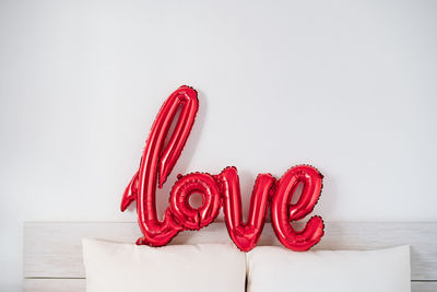 Red love shape balloon at bedroom. valentines concept