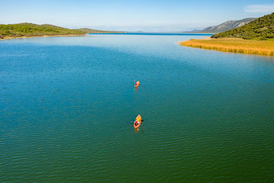 Canoe paddling on vransko lake nature park, croatia