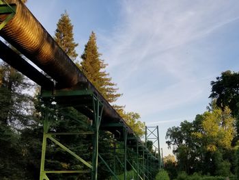 Low angle view of metallic structure against sky