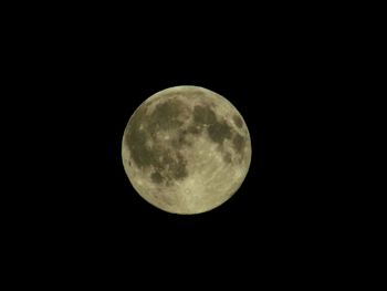 Low angle view of moon against clear sky at night