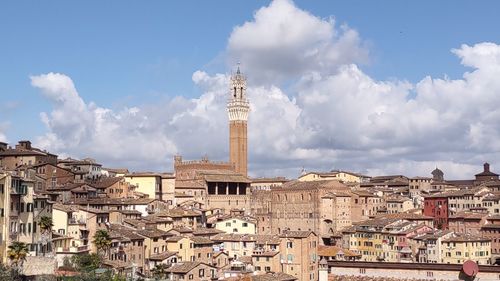 Buildings in city against sky