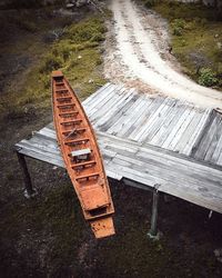 High angle view of abandoned bench on field