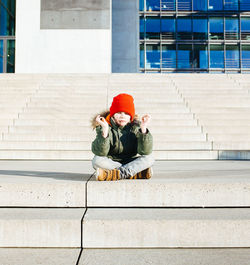 Boy meditating on steps