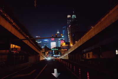 Illuminated bridge at night