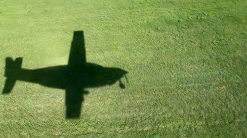 High angle view of silhouette shadow on field