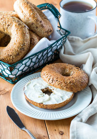 Multigrain bagel with cream cheese.