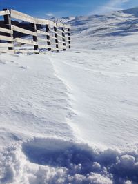 Scenic view of snow covered landscape against sky