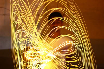 Close-up of wire wool with man in background