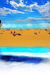 People on beach against blue sky