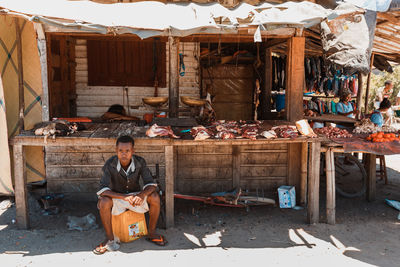 Full length of man working at market