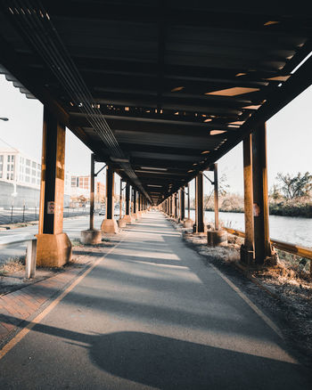 Empty road along bridge