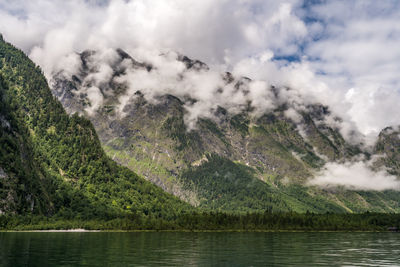 Scenic view of lake and mountains against sky