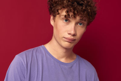 Portrait of man against colored background