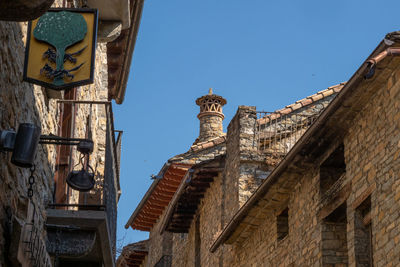 Low angle view of old building against clear sky