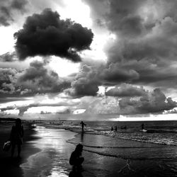 Scenic view of sea against cloudy sky