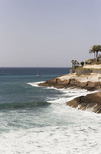 Scenic view of sea against clear sky