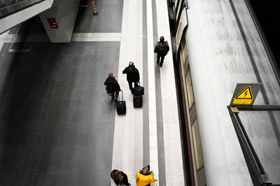 High angle view of people by train at railroad station