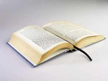 Close-up of open book against white background