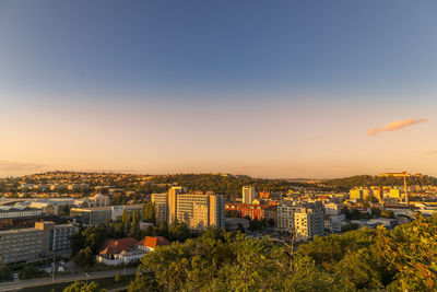 High angle view of buildings against sky at sunset