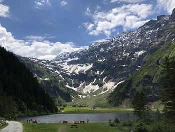 Scenic view of snowcapped mountains against sky