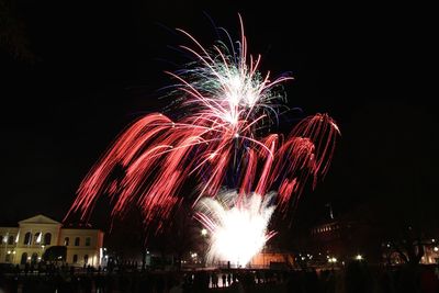 Low angle view of firework display at night