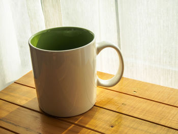 Close-up of coffee cup on table