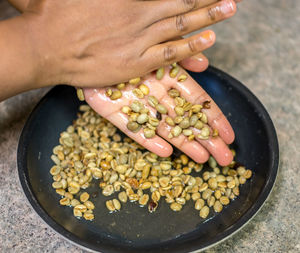 Close-up of hands washing pulses