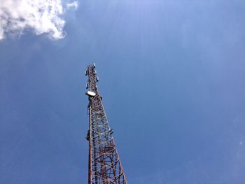 Low angle view of communications tower against sky