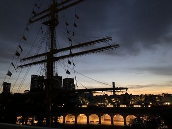 Low angle view of silhouette bridge against sky during sunset