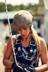 Portrait of young woman sitting outdoors
