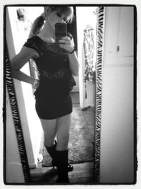 Full length of woman standing on bench