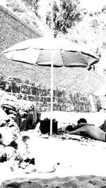 Reflection of man on beach