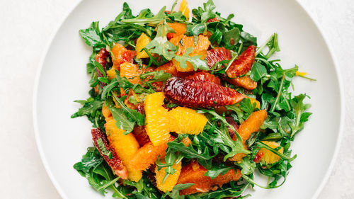 Citrus arugula salad with blood orange, cara cara, and naval oranges