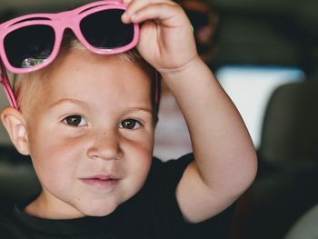 Portrait of cute boy wearing sunglasses