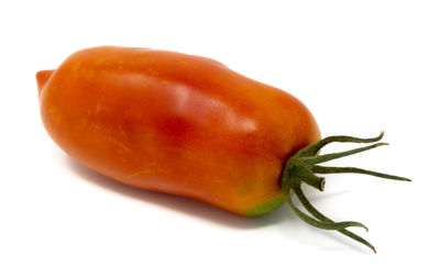 Close-up of orange pepper against white background