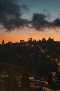 High angle view of illuminated buildings against sky at sunset