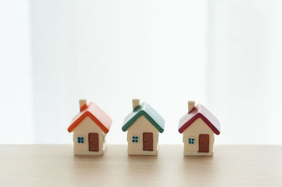 Close-up of toy on table against house