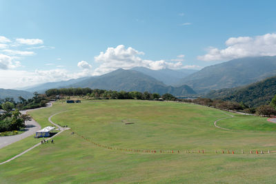 Scenic view of landscape and mountains against sky