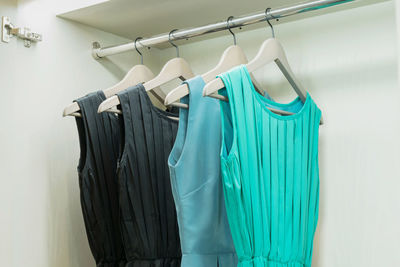 Dresses hanging on rack in store