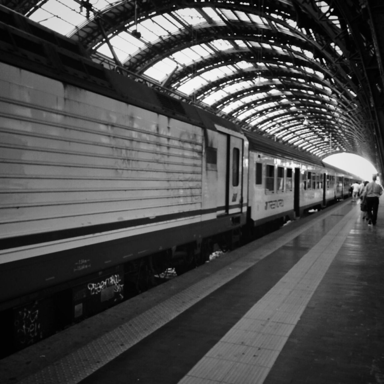 transportation, railroad station platform, railroad station, public transportation, indoors, railroad track, rail transportation, ceiling, architecture, built structure, mode of transport, incidental people, train - vehicle, travel, men, subway station, the way forward, passenger, subway