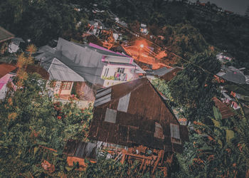 High angle view of houses and trees in town