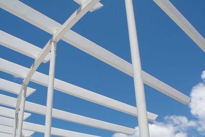 Low angle view of the calyx against blue sky at royal botanic garden in city