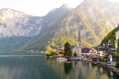 Panoramic view of lake and buildings against sky